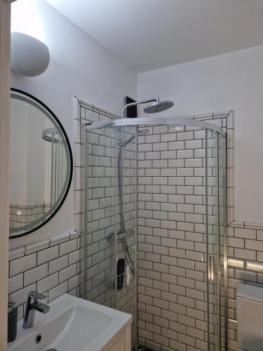 a bathroom with a sink and a mirror at Ultracentral Mangalia seaside exclusive in Mangalia