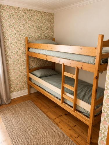 a couple of bunk beds in a room at HomeSweetSweden in Malung