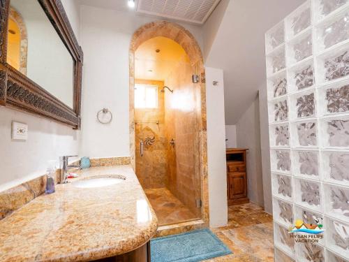 a bathroom with a shower and a sink at Casa Serenity Beachfront Rental in San Felipe