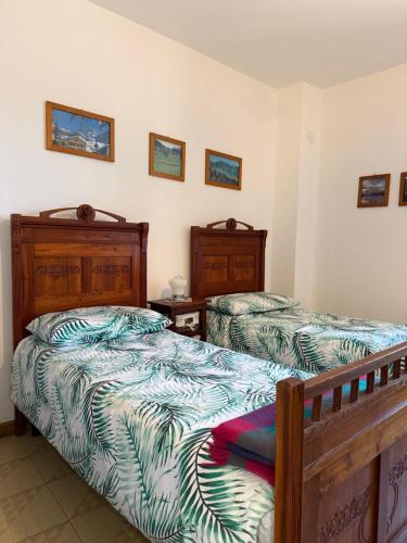 a bedroom with two beds and two night stands at Residenza Dei Castelli in Coredo