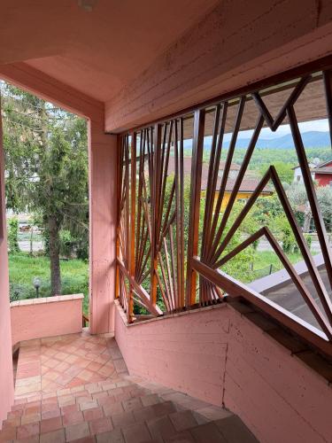 a balcony with a large window with a view at Da Francesca guestrooms in Patrica