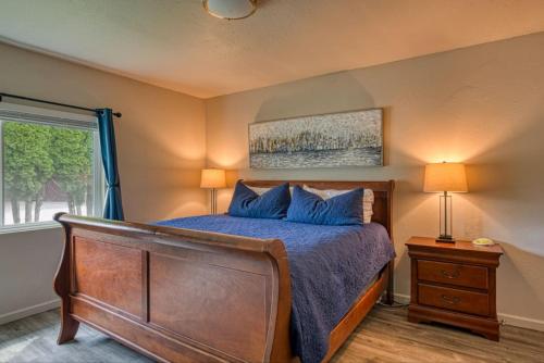 a bedroom with a bed and a window at Lil Blue Dog Haven in Sagle