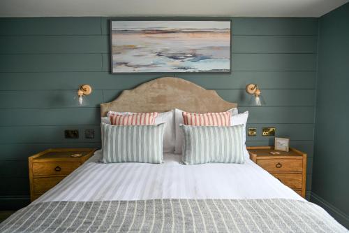 a bedroom with a white bed with two pillows at The Bubble at Stenson in Stanton