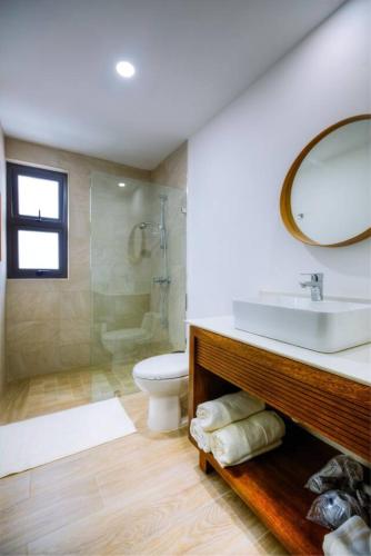 a bathroom with a sink and a shower and a toilet at Luxury Oceanview Condo Rooftop Infinity Pool in Las Terrenas