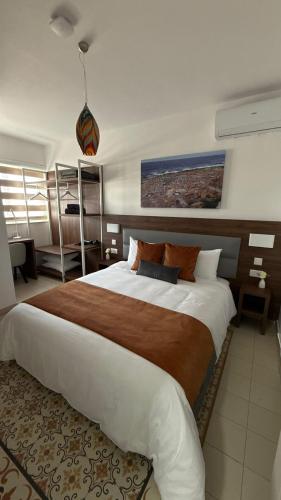 a bedroom with a large bed in a room at Seaview Marsaxlokk Apartment Eye of Osiris in Marsaxlokk