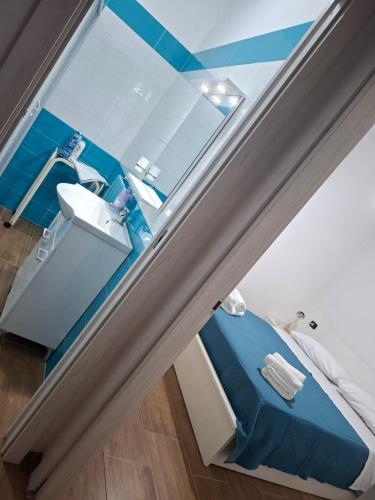 a bathroom with a sink and a mirror at Don Pedro Home in Naples