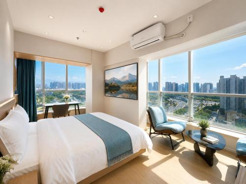 a bedroom with a large bed and large windows at Ancient City Garden Luxury Residence Xian in Xi'an