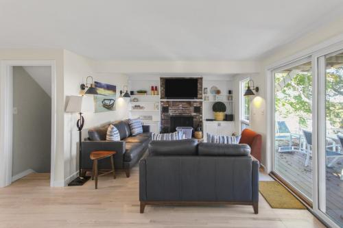 a living room with a couch and a fireplace at The Viewpoint in Provincetown