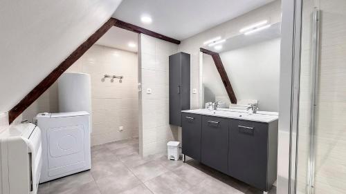 a bathroom with a sink and a toilet at Le Nature in Eguisheim