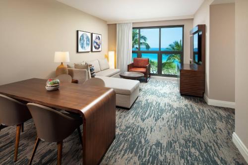 a living room with a couch and a table in a room at The Westin Hapuna Beach Resort in Hapuna Beach