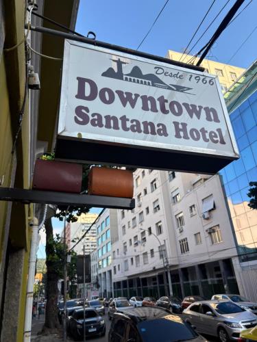 a sign for a downtown santa ana hotel on a street at Downtown Santana Hotel in Rio de Janeiro