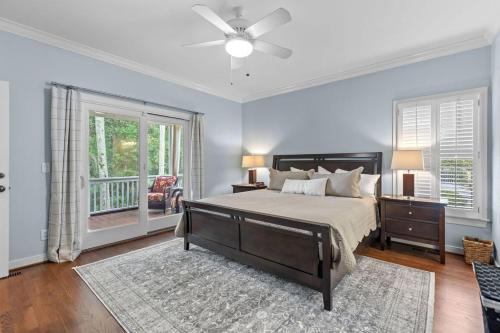 a bedroom with a large bed and a window at 1005 Crooked Oak Lane in Seabrook Island