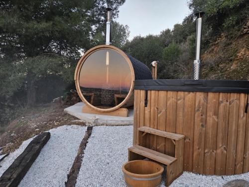 a bath tub with a mirror on the side of it at Wellness Farm Villa - Monte Valeo in Coín