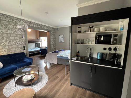 a room with a kitchen and a living room at Eleonora Bed & Breakfast in Kristinestad