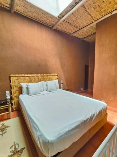 a bedroom with a large bed in a room at Darna in Marrakesh