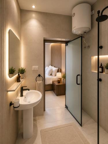 a bathroom with a sink and a bedroom at Vincci Pyramids View in Cairo