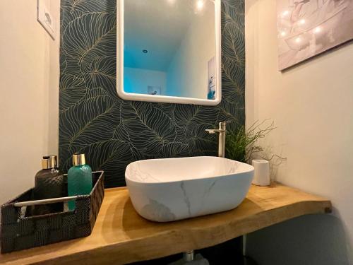 a bathroom with a white sink and a mirror at DMC - Alloggio Turistico in Anzio