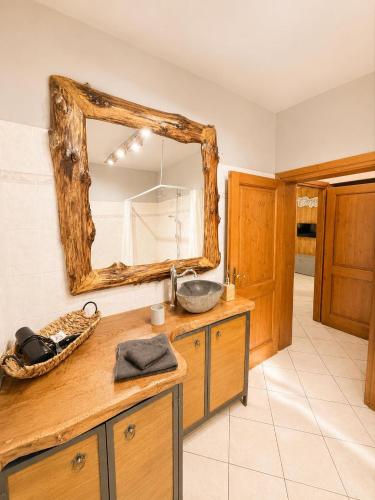 a bathroom with a sink and a mirror at Casa Campomonte 2 in Poppi Stazione