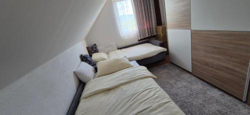 a small room with a bed and a couch at Villa Miševići in Hadžići