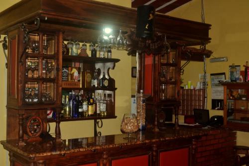 a bar in a room with a lot of alcohol at BellaVista Hotel in Bonito
