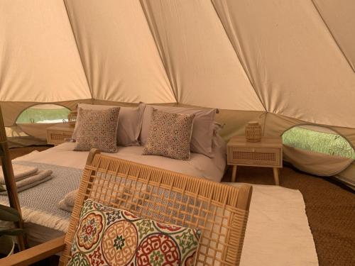 a room with two beds in a tent at Tower Farm Holidays - Glamping in Llangollen