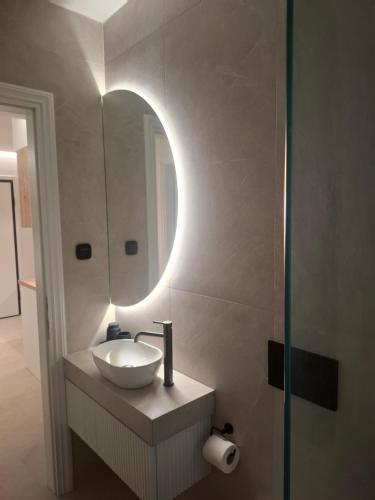 a bathroom with a sink and a mirror at Minimal Nature Escape in Ioannina