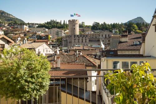 a view of a city from a balcony at Hotel America in Trento