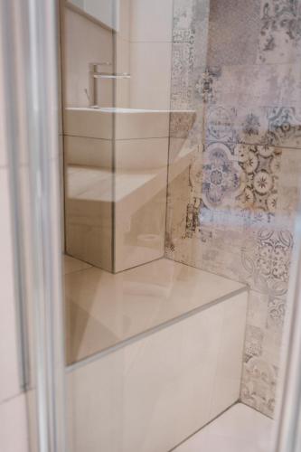 a glass door with a sink in a room at Marinucci Rooms in Termoli