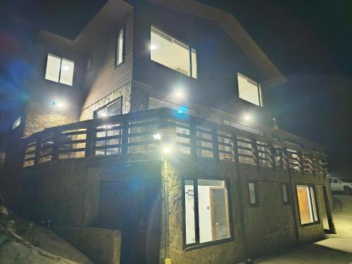 a building with lights on top of it at night at Casa Hotel Los Arrayanes in Constitución