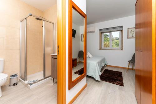 a bathroom with a shower and a toilet at Quinta de Real in Valença