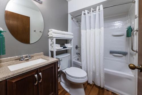 a bathroom with a toilet and a sink and a shower at Pine Grove Resort in Ephraim