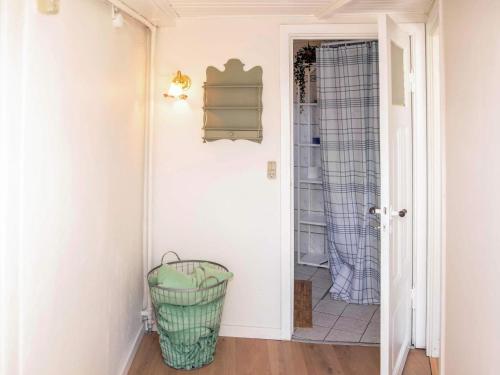 a hallway with a wicker basket in a room at Historic Gem in Samsø in Brundby