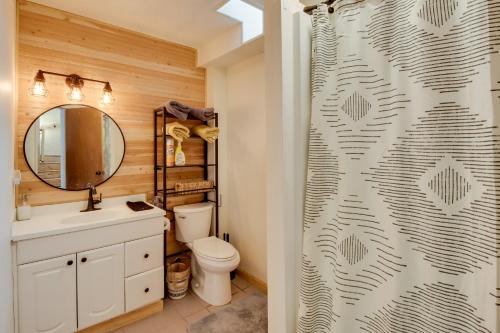 a bathroom with a toilet and a shower curtain at 3-Unit Combo w/ Dock on Lake Keowee - Hike & Fish! in Seneca