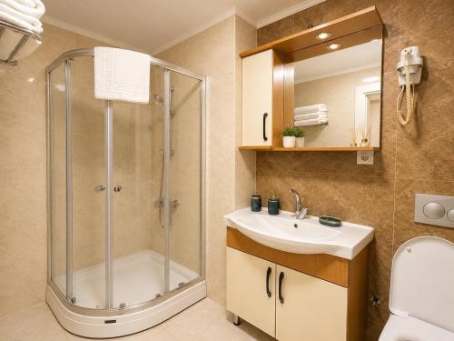 a bathroom with a shower and a sink at ISTANBUL STAY Boutıque Hotel in Istanbul