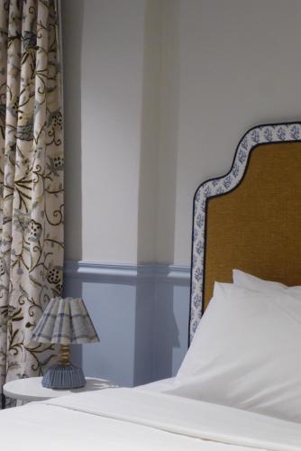 a bedroom with a bed with a white bedspread at No 9 Springfield in Sydney