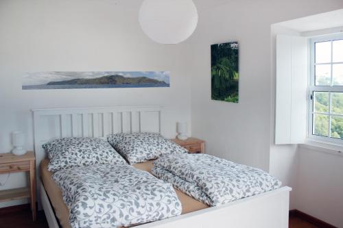 מיטה או מיטות בחדר ב-Casa Emilia