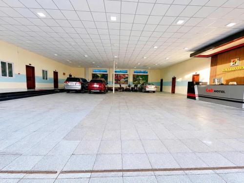 a large parking lot with cars parked in it at Cali Hotel Tây Ninh in Tây Ninh