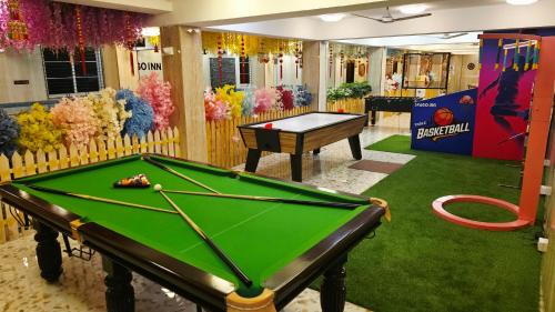a room with a pool table and a piano at Spago Inn-Only for Families & Couples not for Bachelors in Mahabalipuram