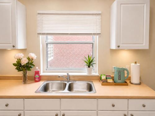 a kitchen counter with a sink and a window at Vita House - Minutes to Rogers Stadium - Walk or Transit - Near VELD Downsview and Yorkdale in Toronto