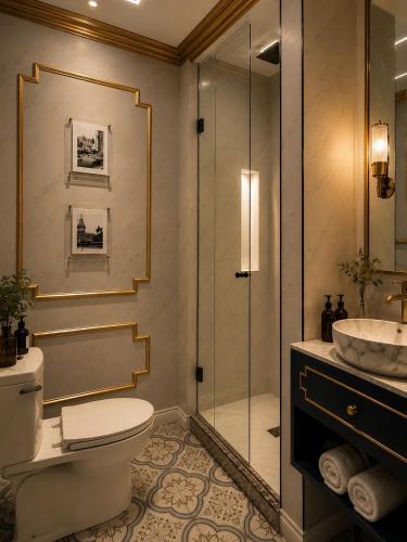 a bathroom with a shower and a toilet and a sink at Salvo 1928 in Montevideo