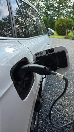 a car with a car charger attached to it at Sov Godt i Arnborg Bed & Breakfast in Arnborg