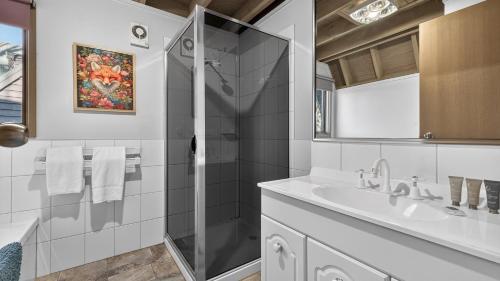 a bathroom with a shower and a sink at Coho in Dinner Plain