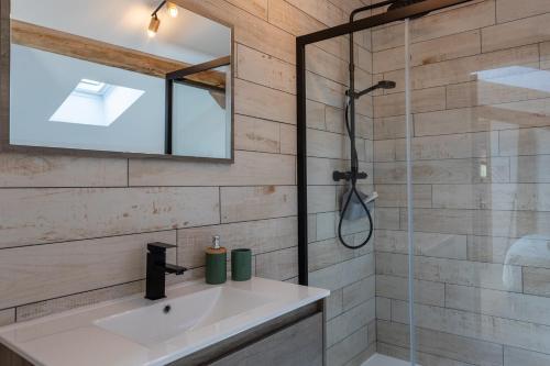 a bathroom with a sink and a shower at Gite Goxa Leku in Ossès