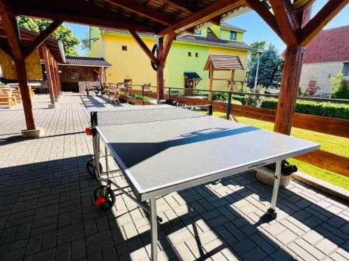 two ping pong tables on a patio at Bořikovský Dvůr in Litovany