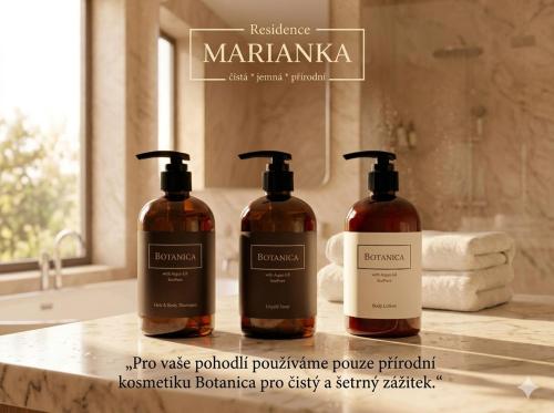 two bottles of soap on a counter in a bathroom at Residence Marianka in Albrechtice v Jizerských horách