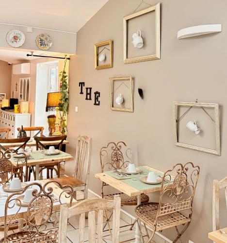 a dining room with a table and chairs at Fleur de Ré in Loix