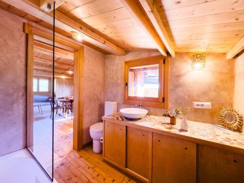 a bathroom with a sink and a toilet at Bioloco - sea, nature, pool in Castiadas