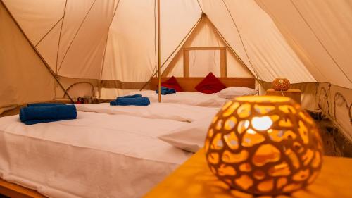 a room with a bed in a tent at Bioloco - sea, nature, pool in Castiadas