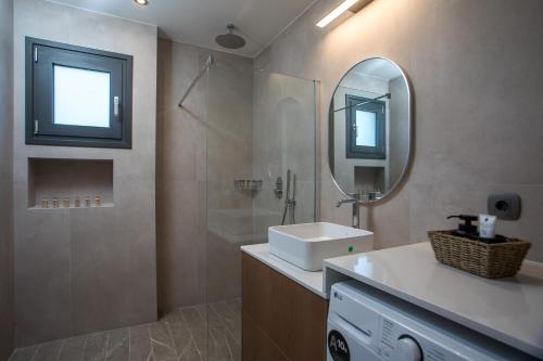 a bathroom with a sink and a mirror at Casadi Fileri Villa in Ialysos