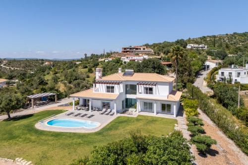 an aerial view of a house with a swimming pool at Paradise Villa Cabanita Loulé in Loulé